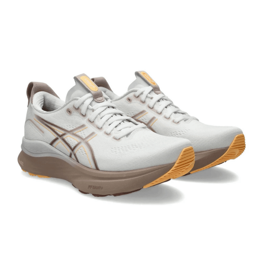 On-feet Asics Gel-Kayano 32 White Orange Glow lifestyle photo Dubai UAE