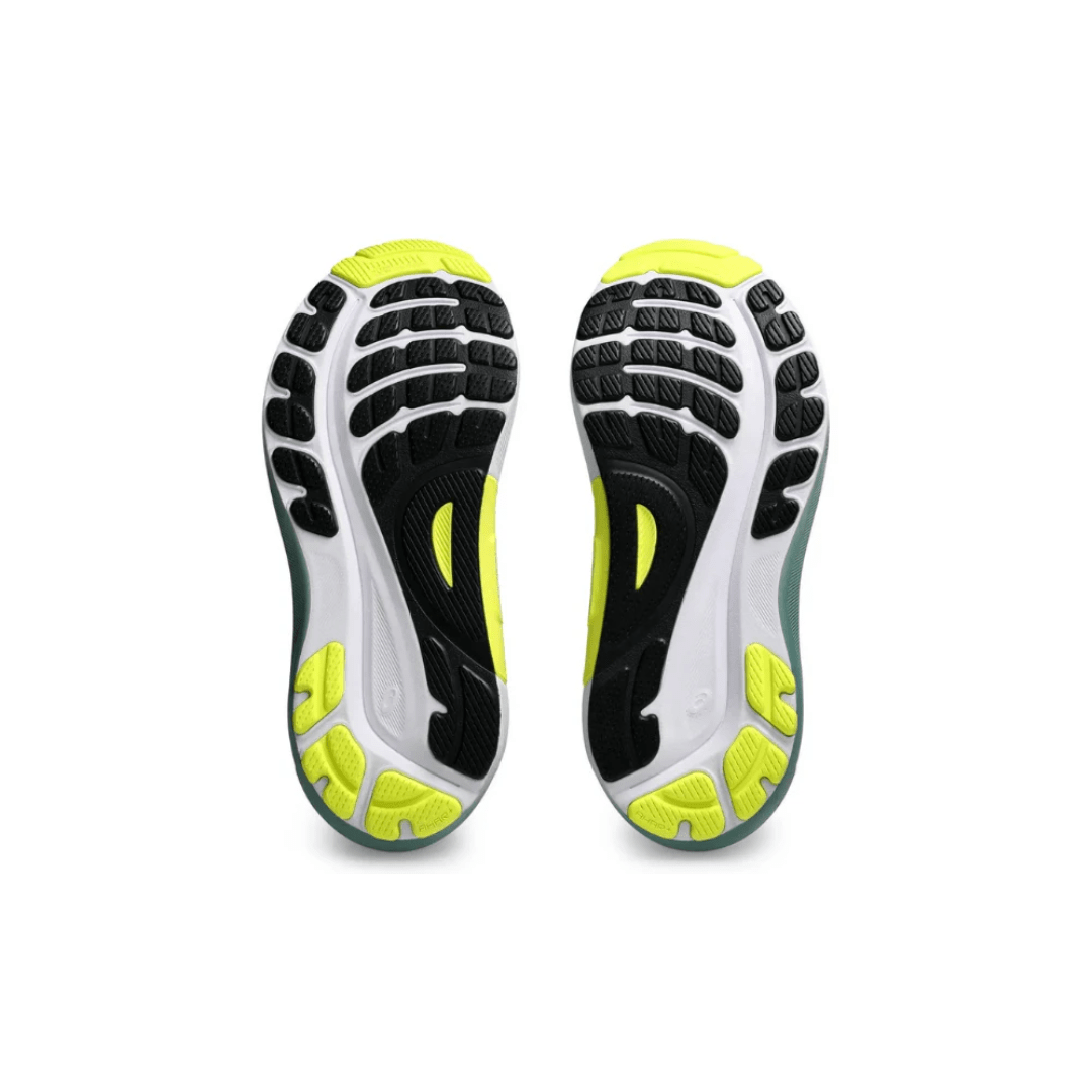 Flat lay of Asics Gel Kayano 31 Cool Matcha Celadon shoes on Dubai background