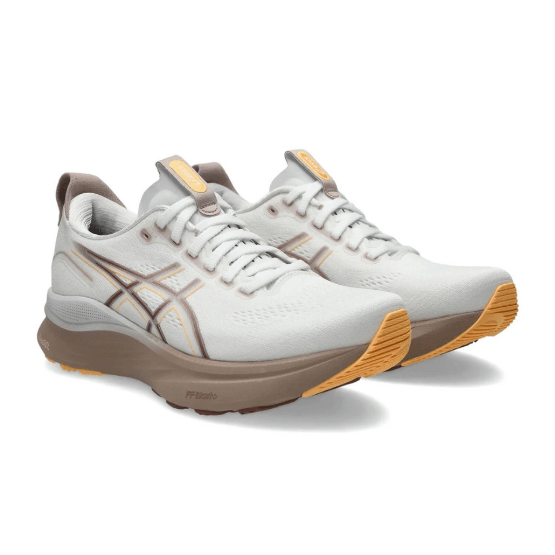 On-feet Asics Gel-Kayano 32 White Orange Glow lifestyle photo Dubai UAE