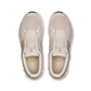 Pair of beige running shoes on a white background