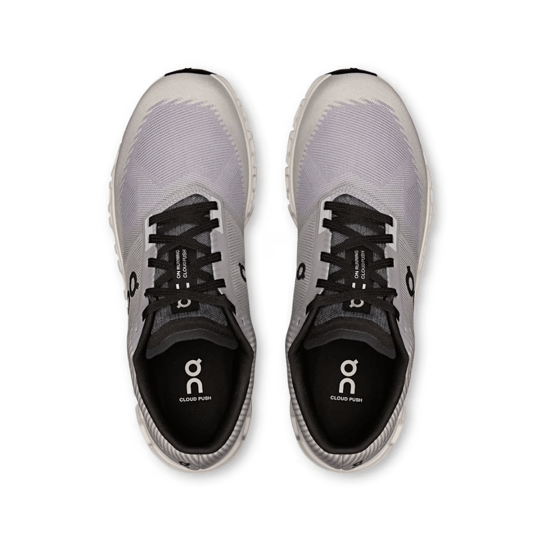 Gray running shoes with black soles on a white background