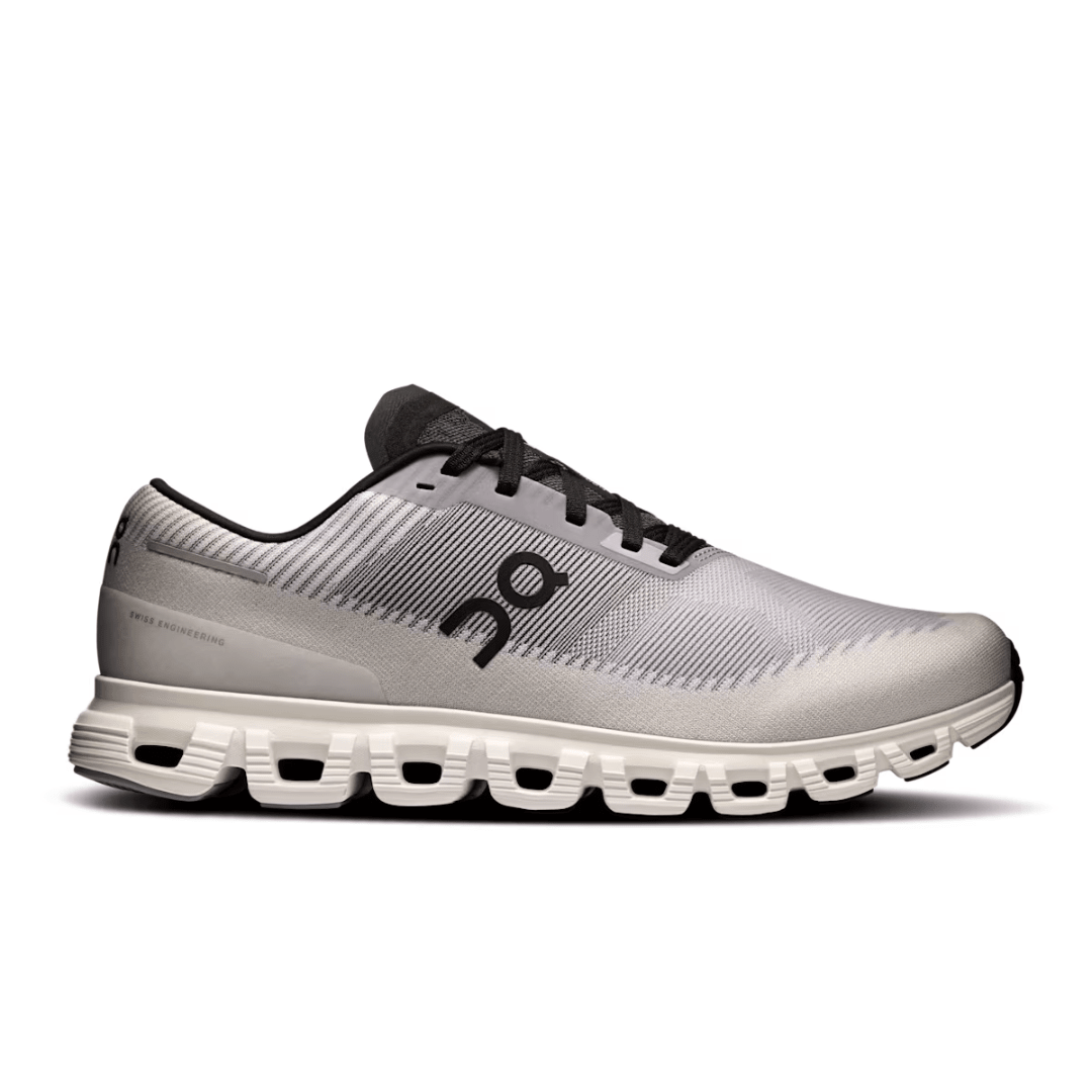 White running shoe with black accents on a white background