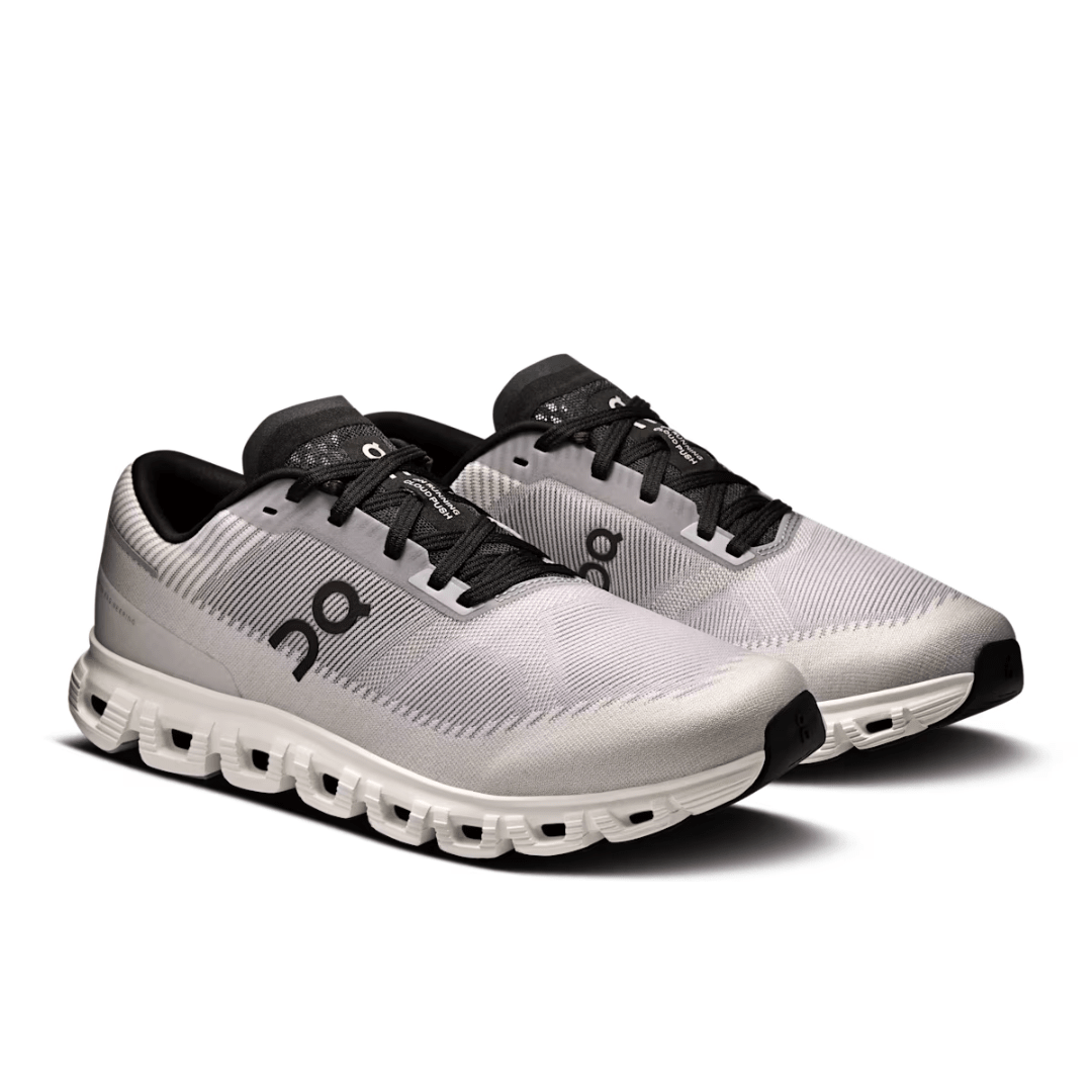 White running shoes with black accents on a white background