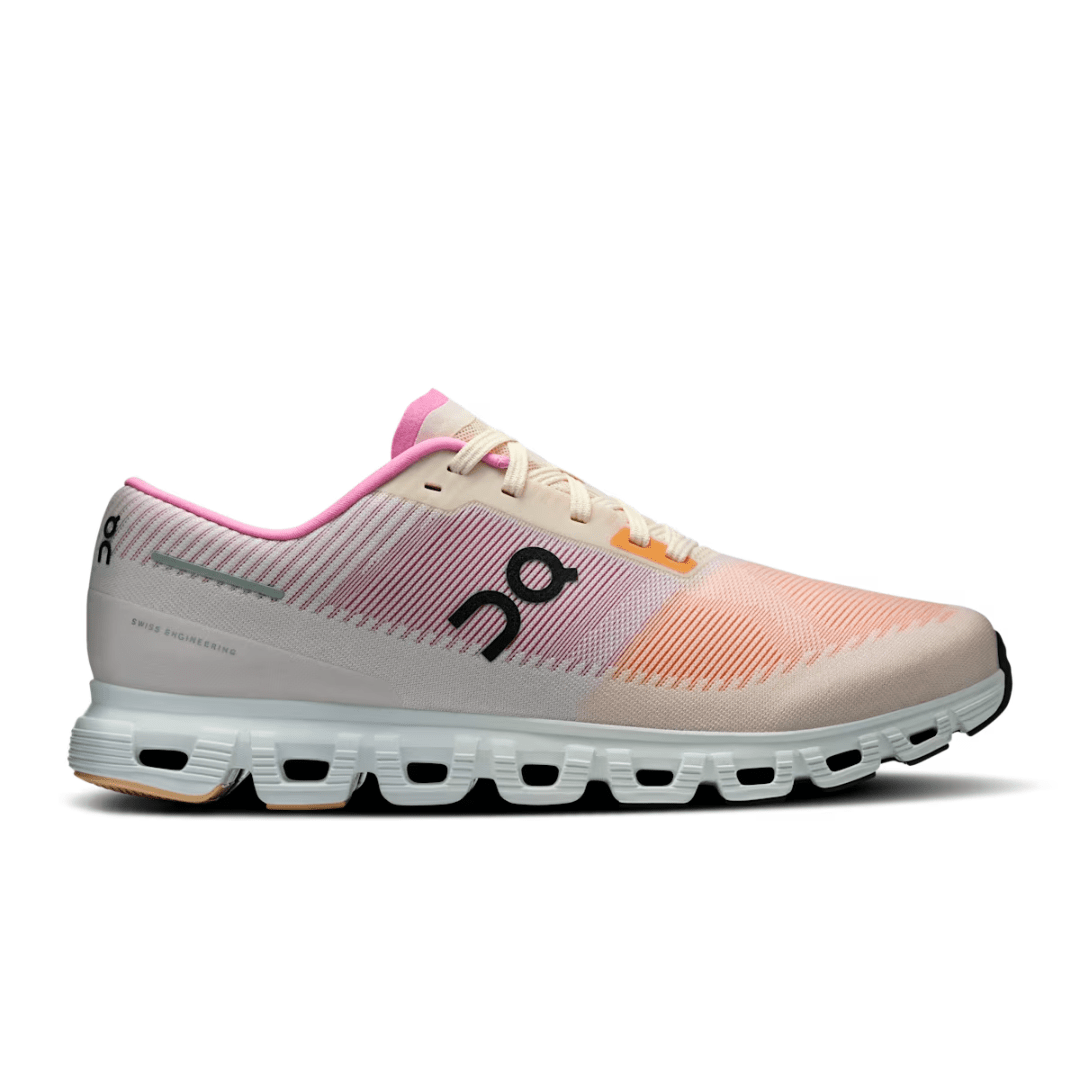 Pink and beige running shoe with white sole on a white background