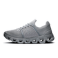 Gray running shoe with unique sole design on a white background