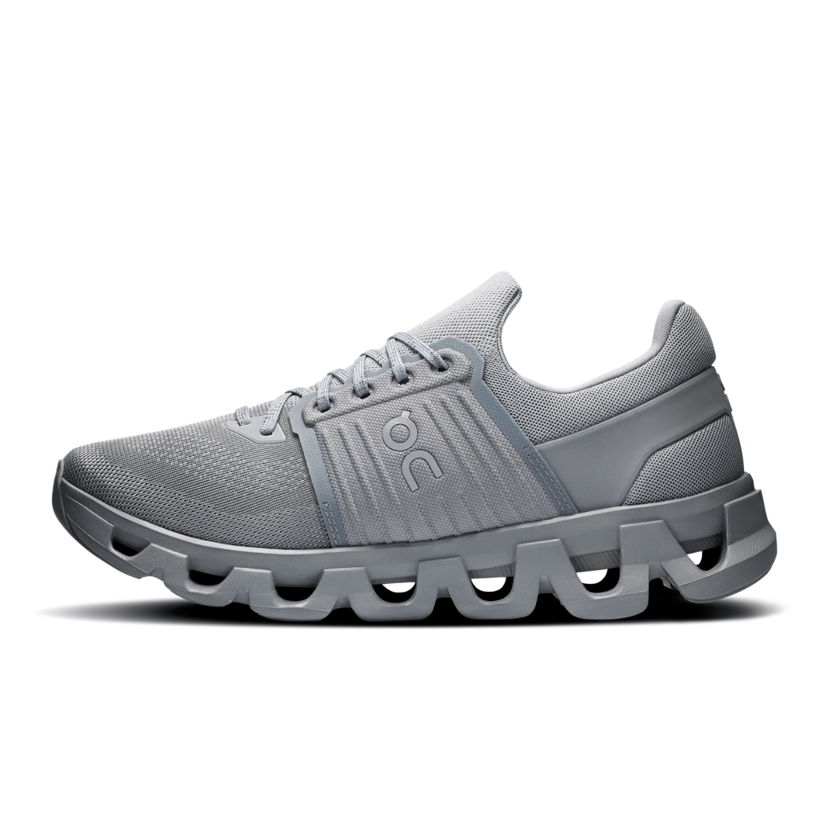 Gray running shoe with unique sole design on a white background