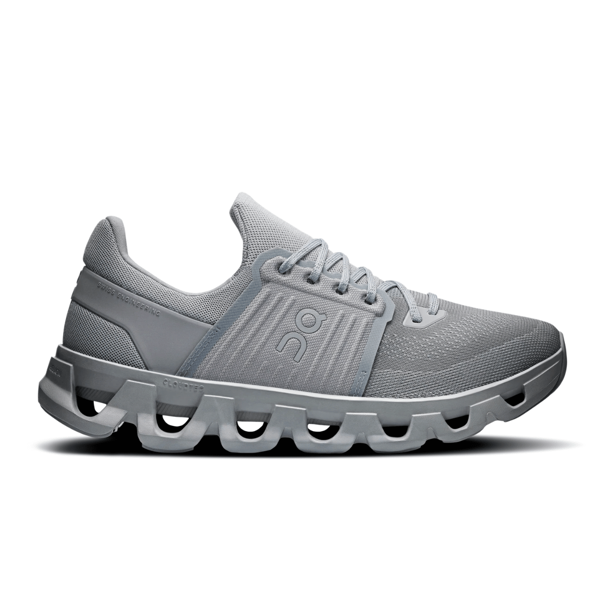 Gray running shoe with unique sole design on a white background