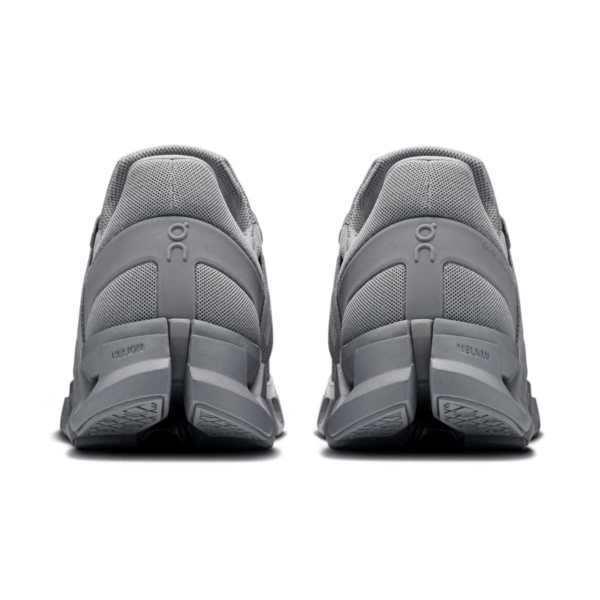 Gray athletic shoes with 'On' branding on a white background