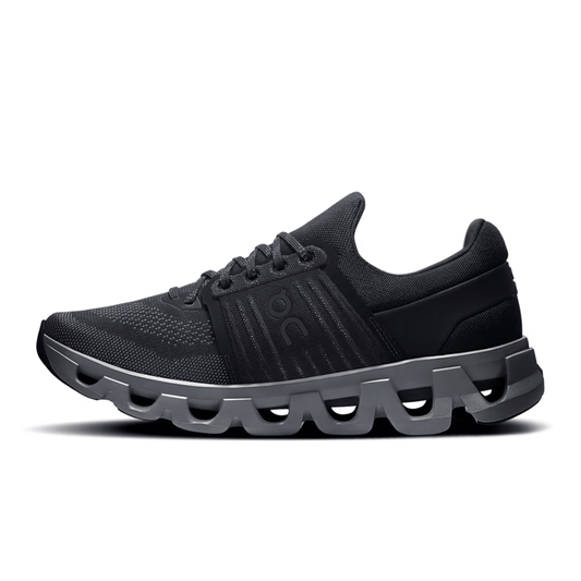 Black running shoe with unique sole design on a white background