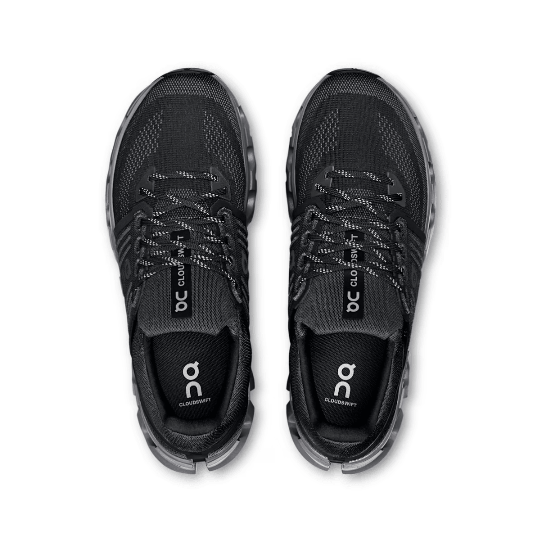 Black running shoes with 'On' branding on a white background