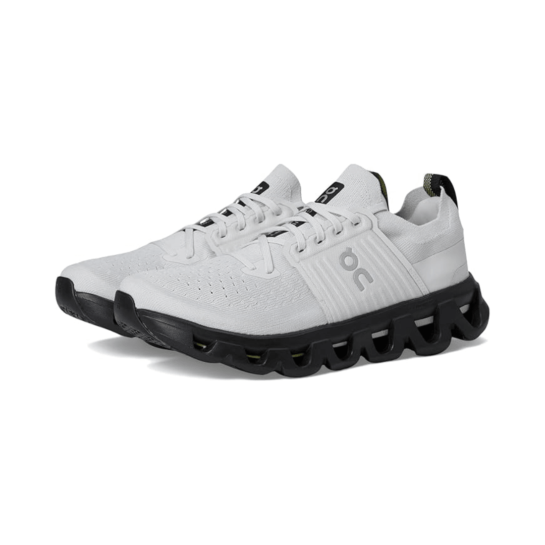 White running shoe with black sole on a white background