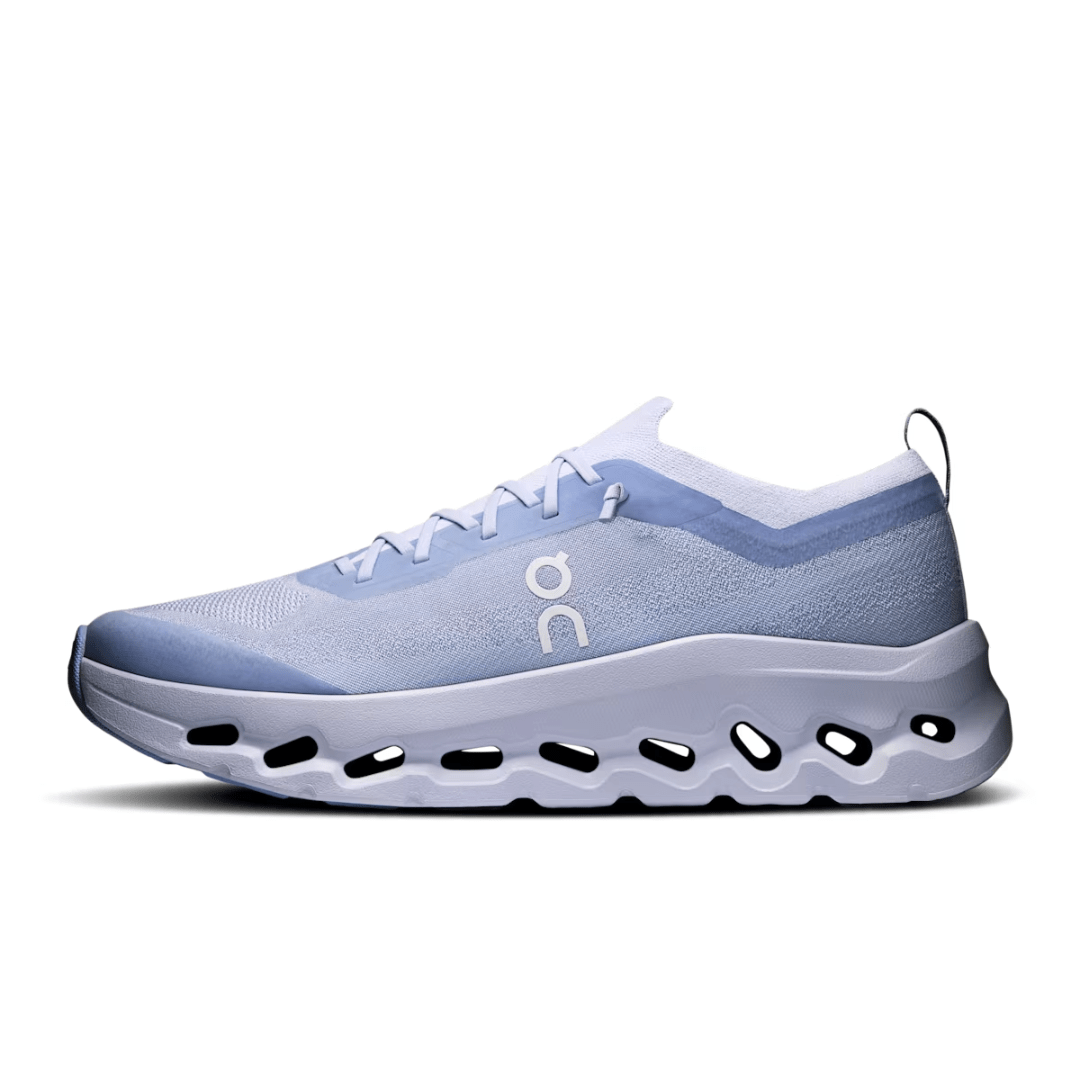 Light blue running shoe with white sole on a white background