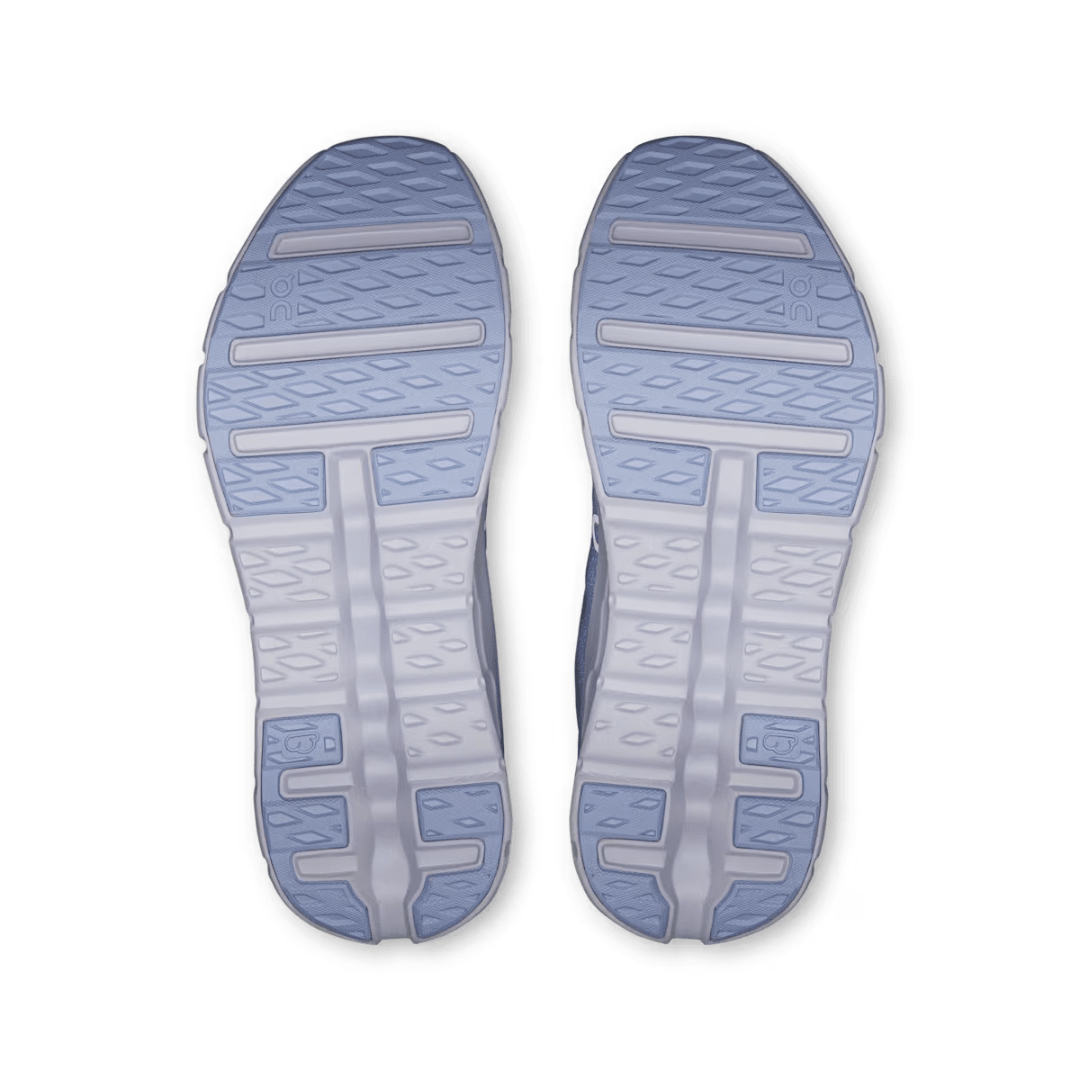 Top view of a pair of blue and gray shoe soles on a white background