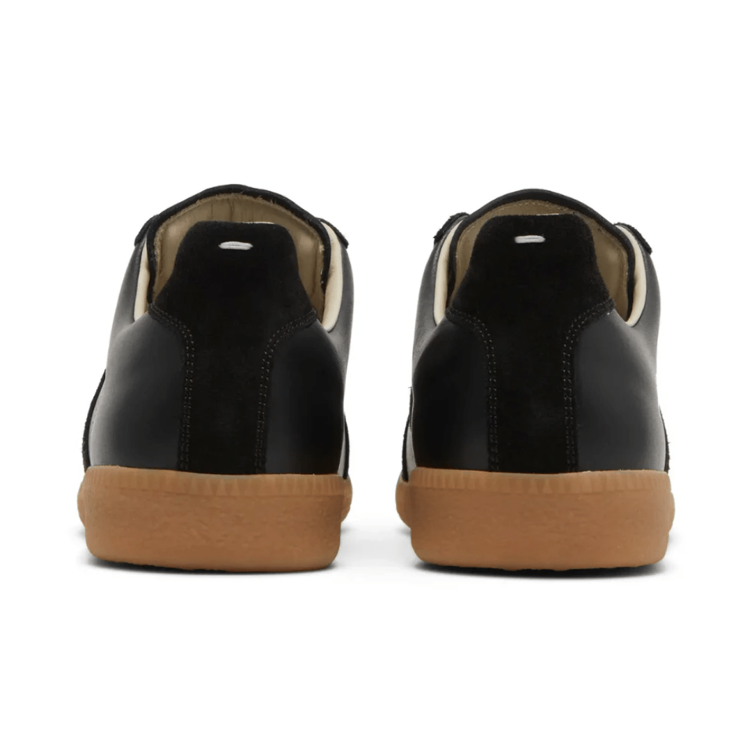 Lifestyle photo of Maison Margiela Replica Black Gum sneakers Dubai