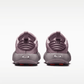 Pair of purple children's shoes on a white background