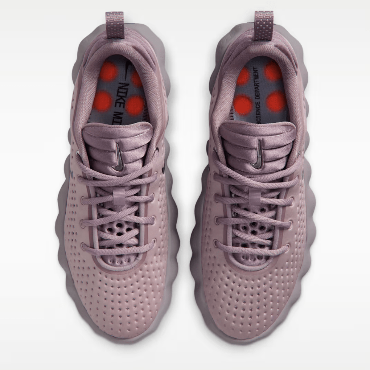 Pair of light purple sneakers with red accents on a white background
