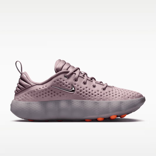Pink running shoe with Nike logo on a white background