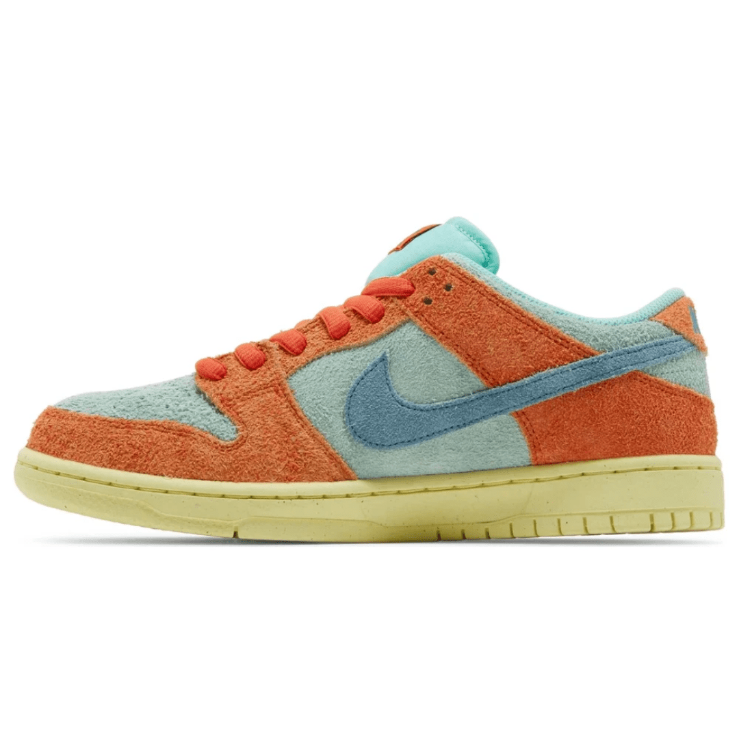 Stylish streetwear look featuring Nike Dunk Low SB Orange Emerald Rise.