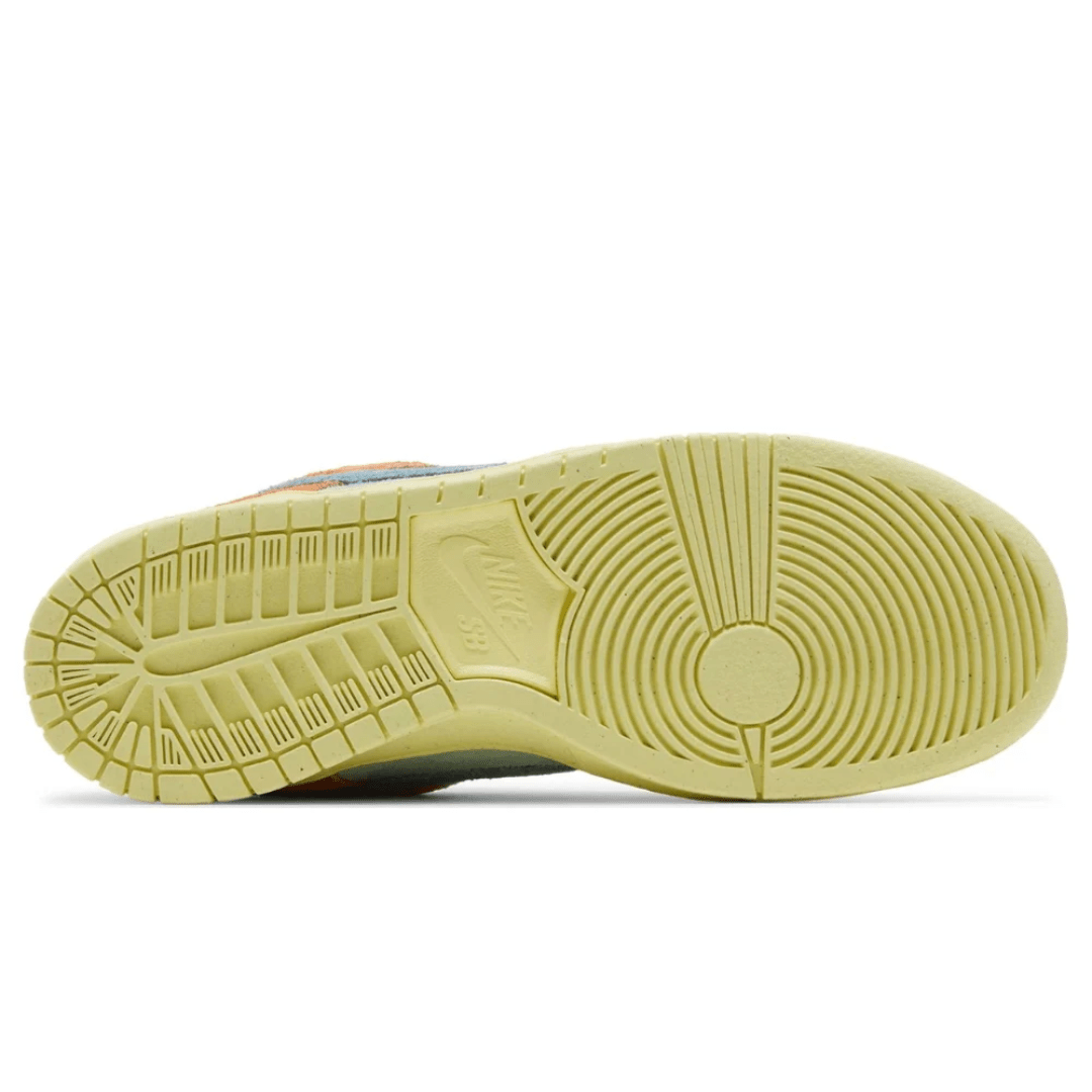 Skater wearing Nike Dunk Low SB Orange Emerald Rise at DXB Skate Park.