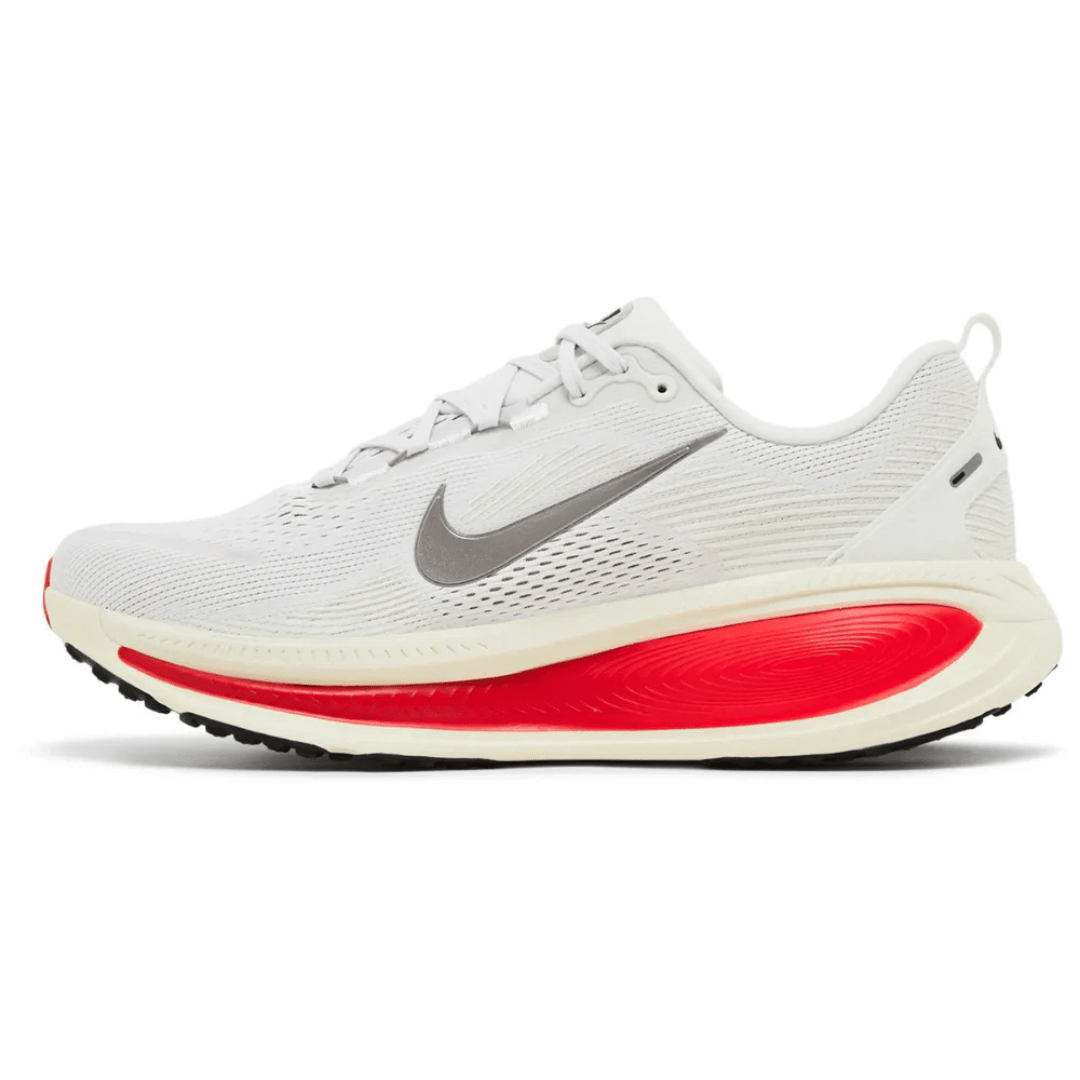 Bottom sole pattern of Nike Vomero 18 Platinum Tint Siren Red showing grip design