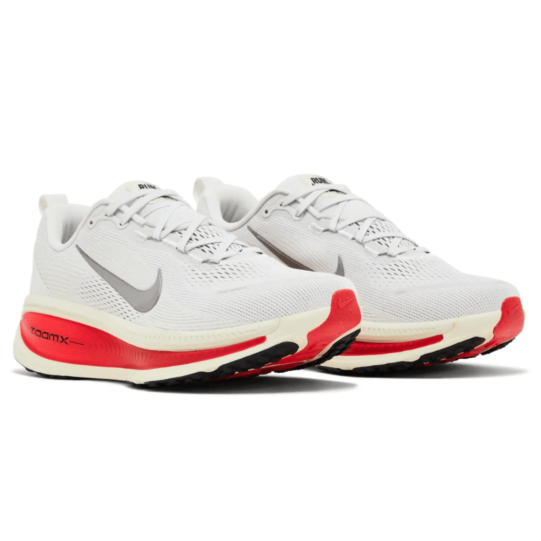 Rear heel Nike Vomero 18 Platinum Tint Siren Red with Nike Swoosh logo