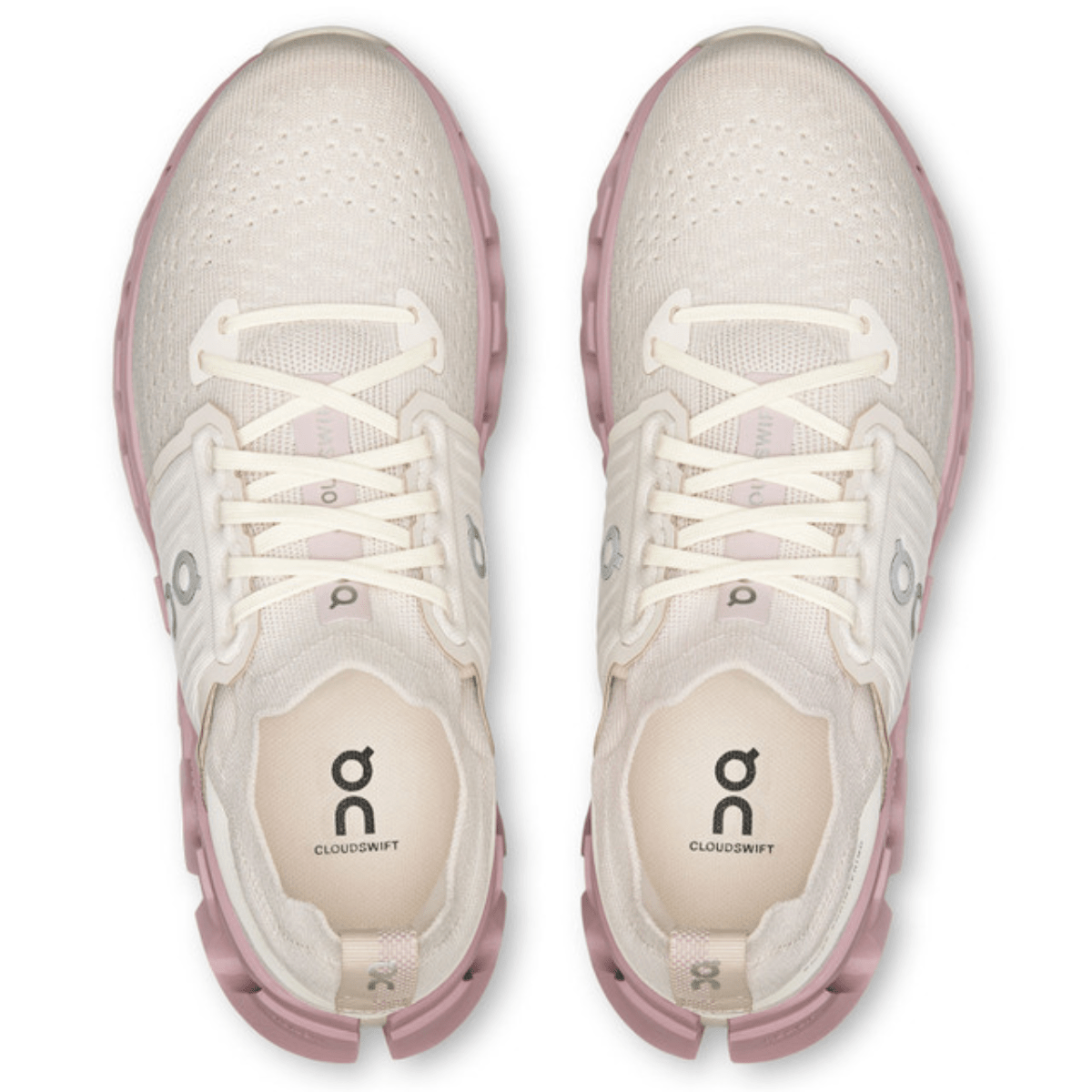 White and pink athletic shoes with visible brand logo on a white background