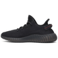 On-feet Yeezy Boost 350 V2 Black Red lifestyle photo Dubai UAE