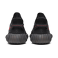 Lifestyle shot Yeezy Boost 350 V2 Black Red sneakers Dubai UAE