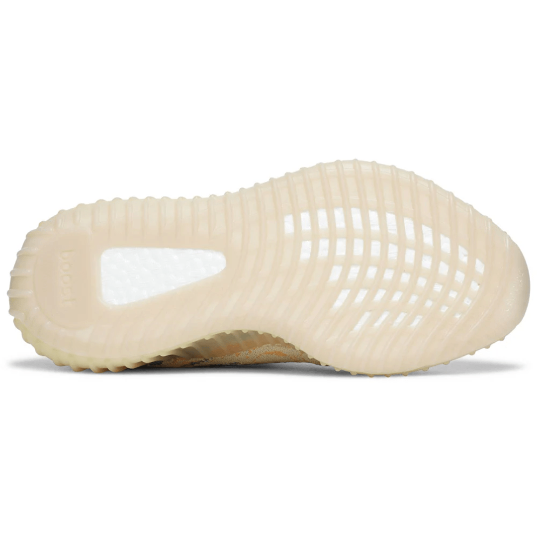 Person wearing Yeezy Boost 350 V2 MX OAT in Dubai streets.