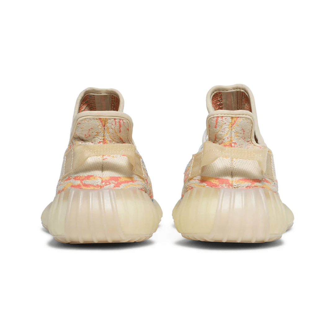 Close-up of Primeknit texture on Yeezy MX OAT sneakers.