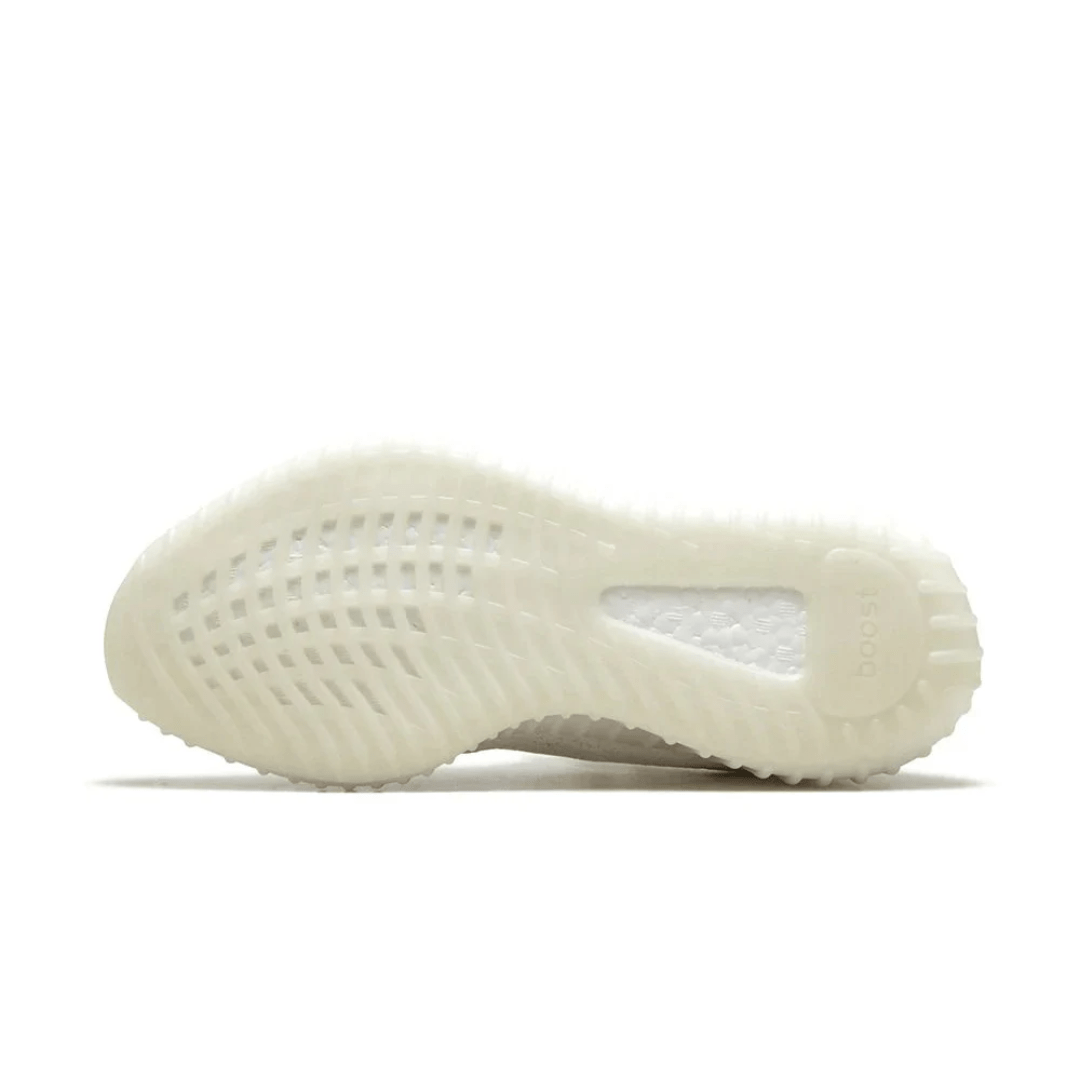 Model wearing Yeezy Boost 350 Triple White sneakers in Dubai