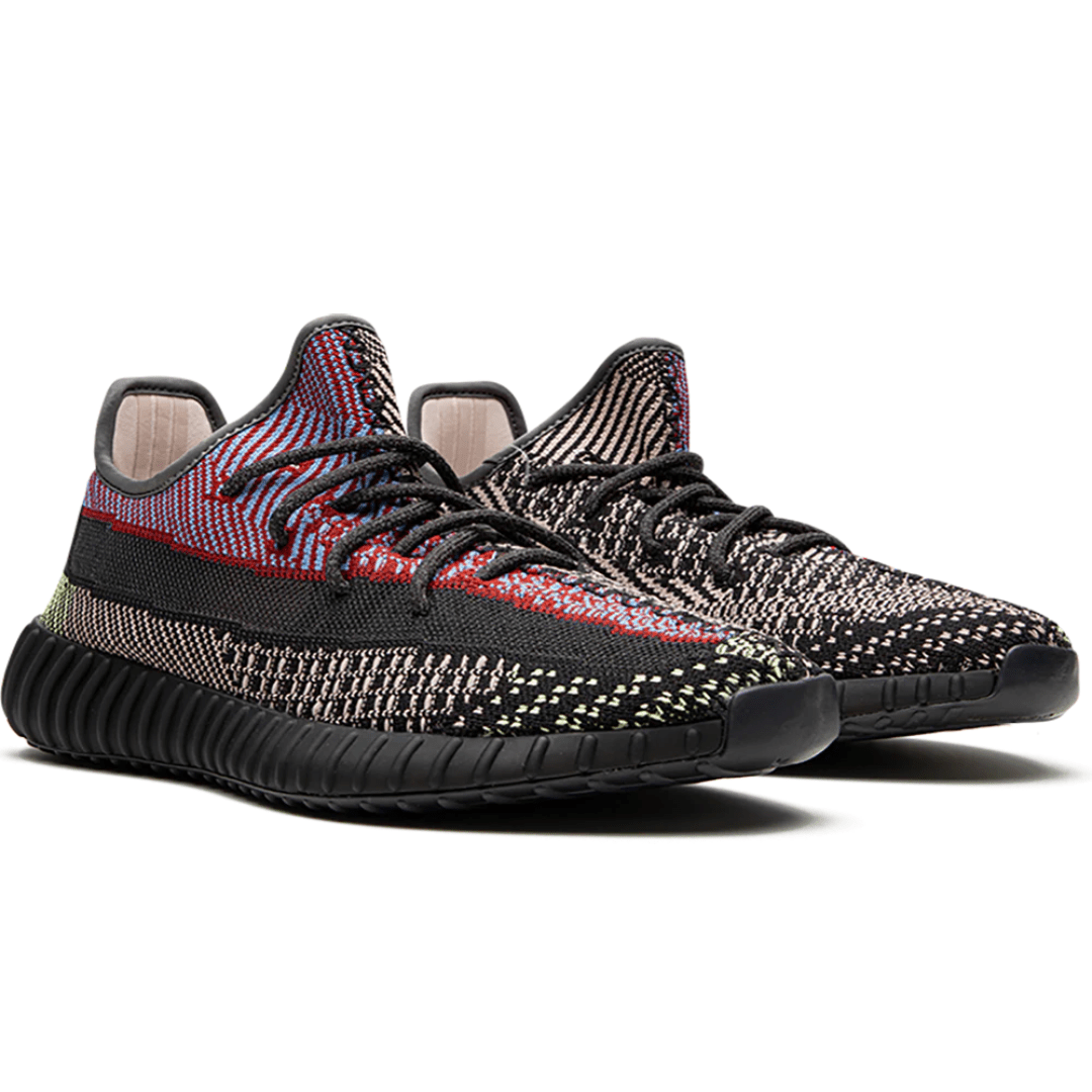 Side profile of Yeezy Boost 350 V2 Yecheil in Dubai sunlight.